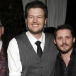 Blake Shelton smiles beside Brandon Blackstock at an event, years before their professional and personal relationship came to an end.