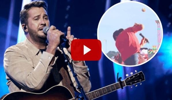 Luke Bryan smiling and talking into the mic during his Country Song Came On Tour
